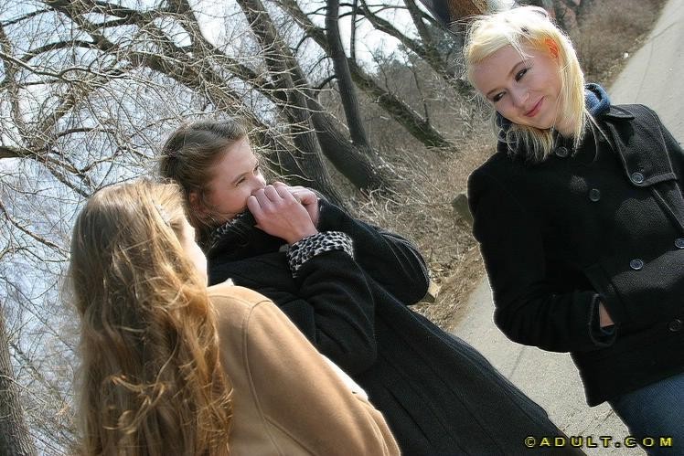 Three cute playful lesbians walking in the park #74037229