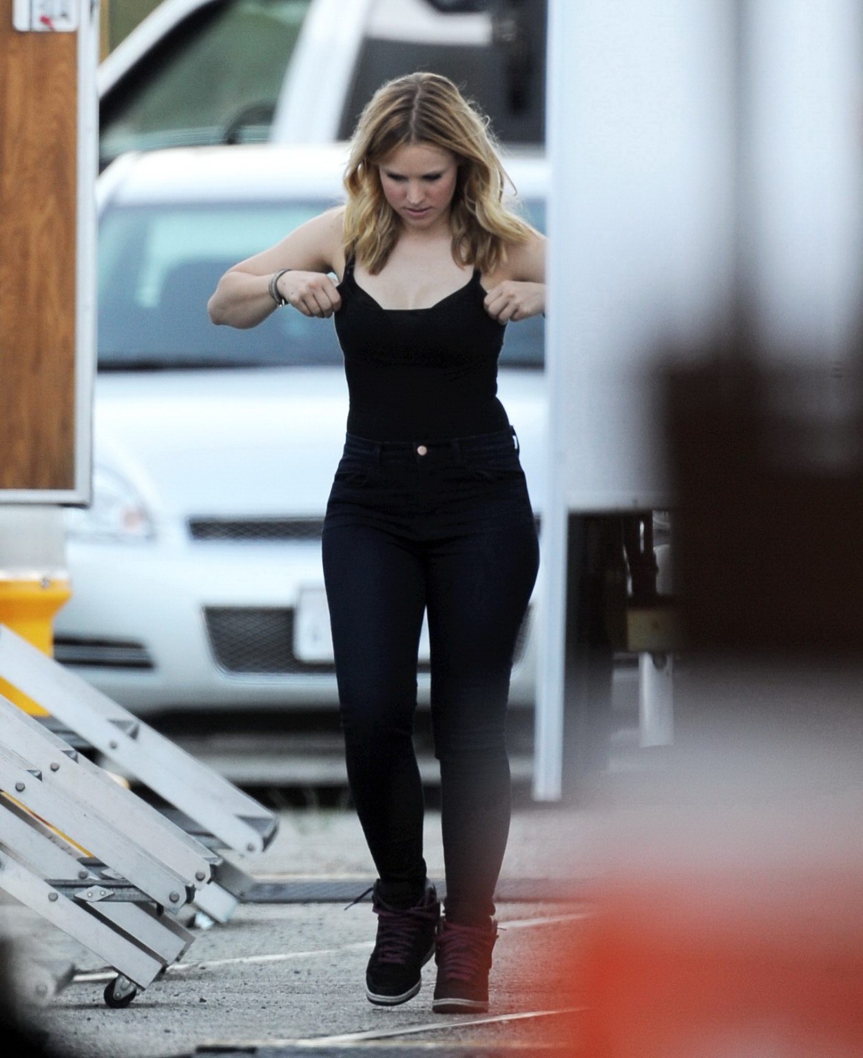 Kristen Bell slipping out of a skimpy black top on the set of Veronica Mars in L #75224412