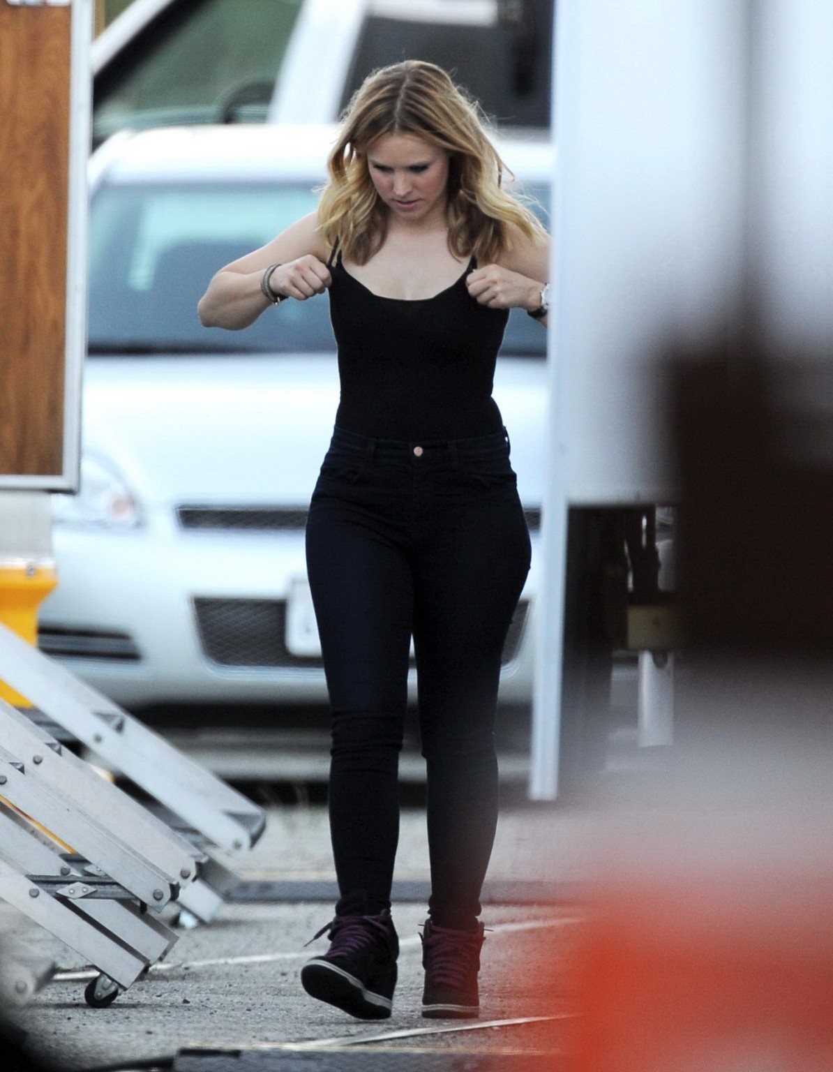 Kristen Bell slipping out of a skimpy black top on the set of Veronica Mars in L #75224421