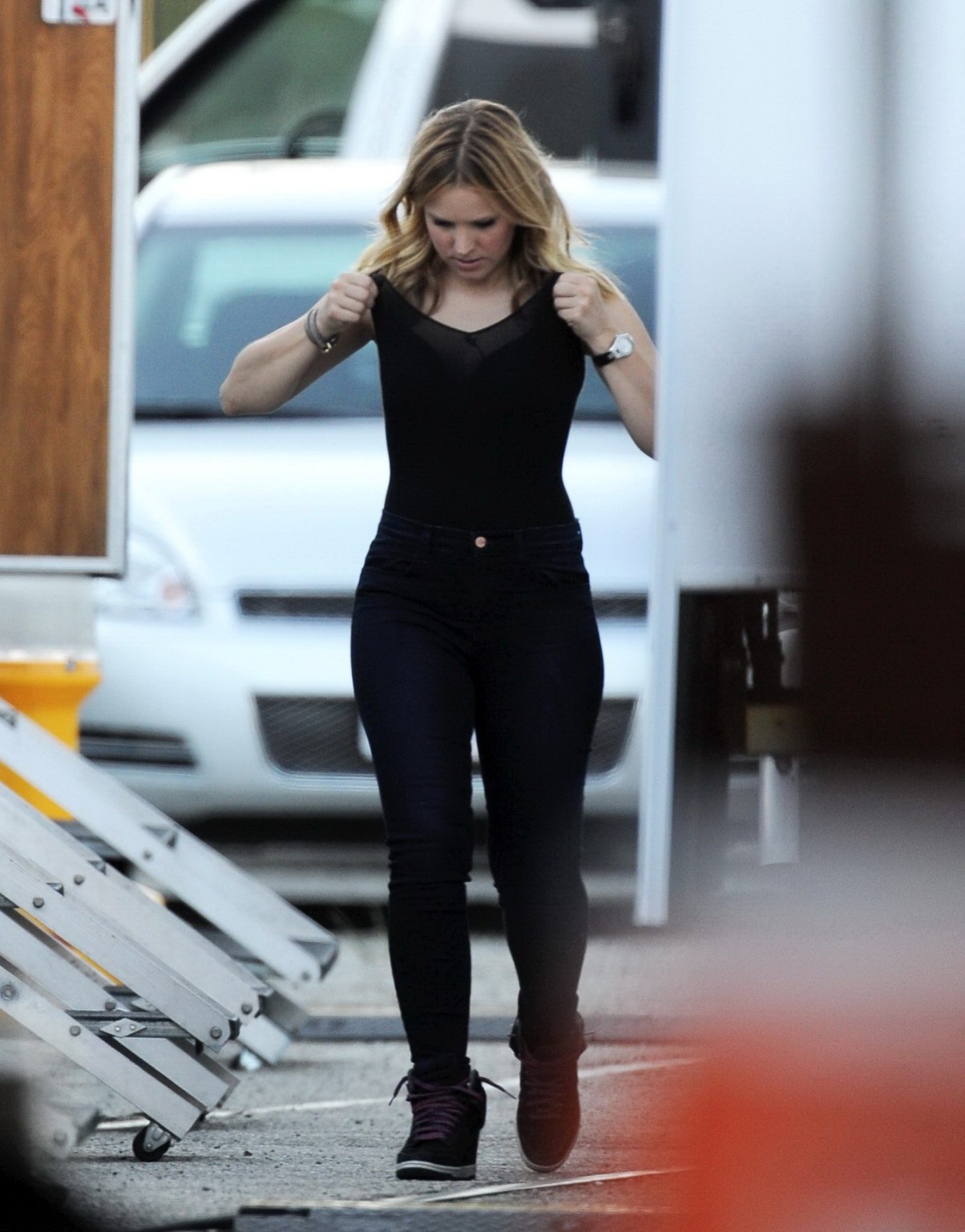 Kristen Bell slipping out of a skimpy black top on the set of Veronica Mars in L #75224431