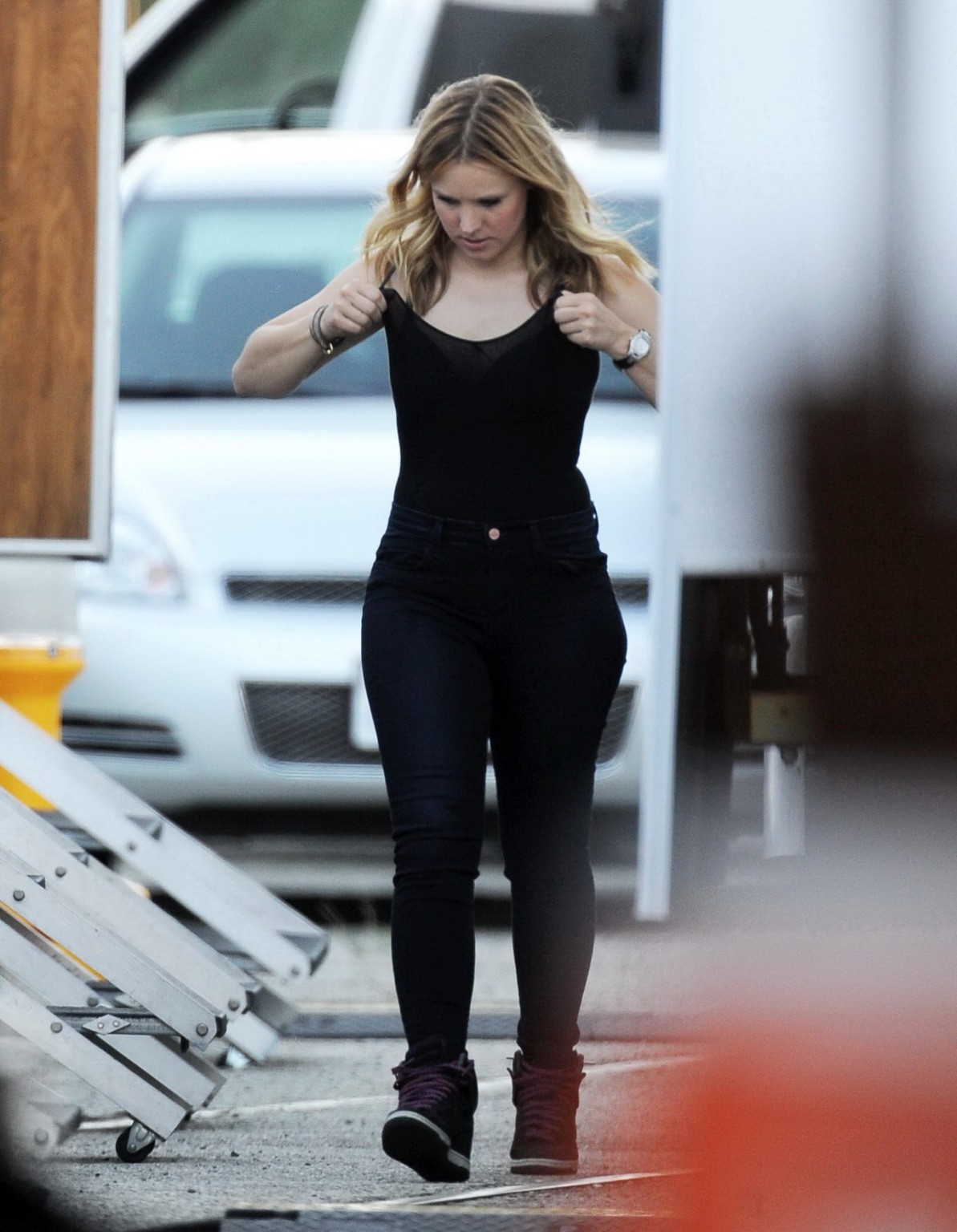 Kristen Bell slipping out of a skimpy black top on the set of Veronica Mars in L #75224441