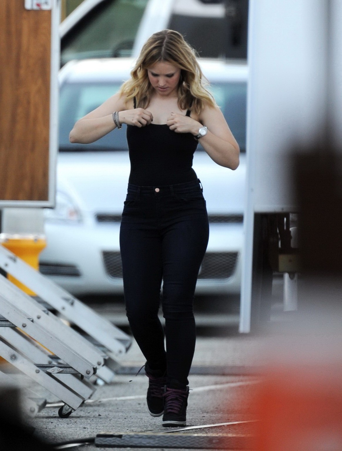 Kristen Bell slipping out of a skimpy black top on the set of Veronica Mars in L #75224451