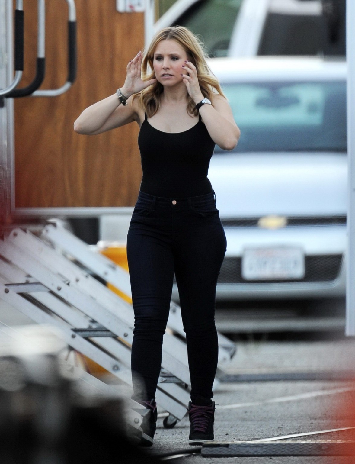 Kristen Bell slipping out of a skimpy black top on the set of Veronica Mars in L #75224460