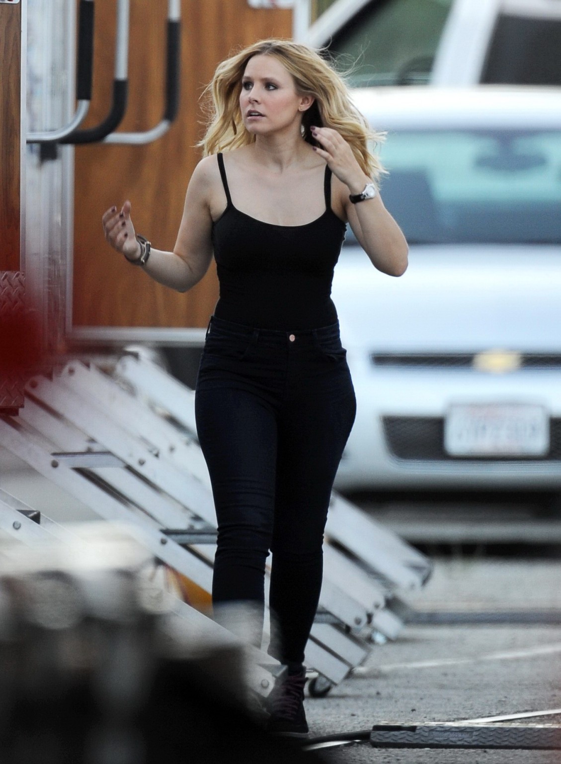 Kristen Bell slipping out of a skimpy black top on the set of Veronica Mars in L #75224488
