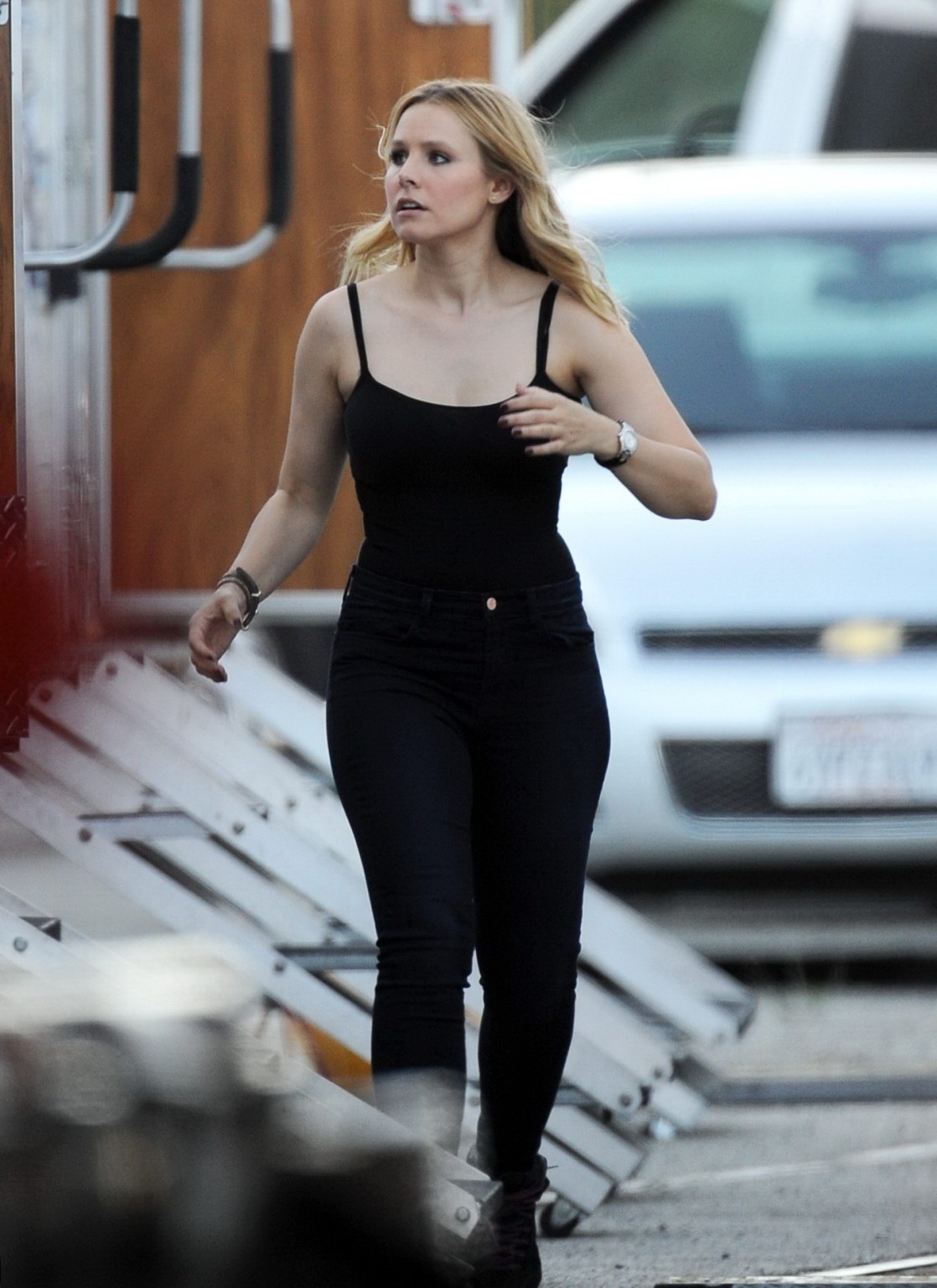 Kristen Bell slipping out of a skimpy black top on the set of Veronica Mars in L #75224495