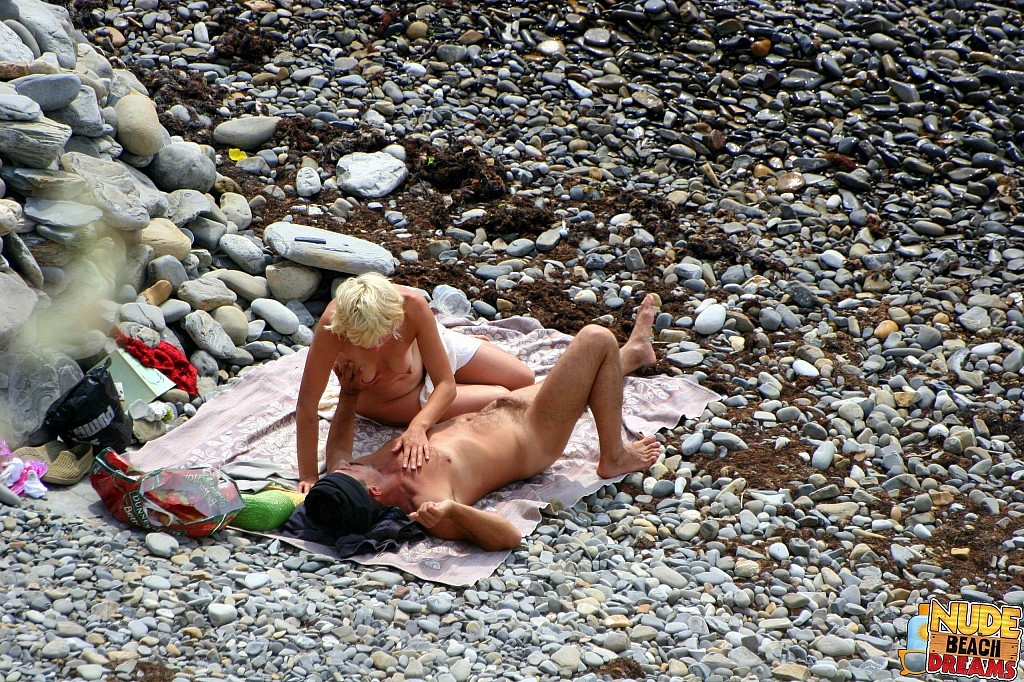 Horny couple enjoing sun and sex on the beach #67302046