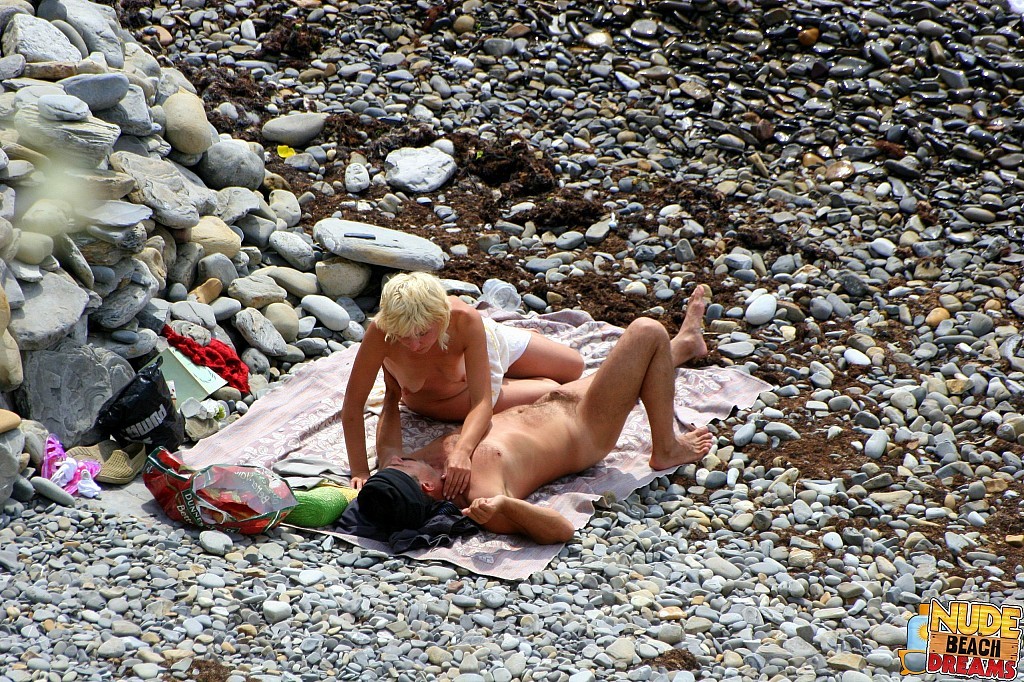 Horny couple enjoing sun and sex on the beach #67302054