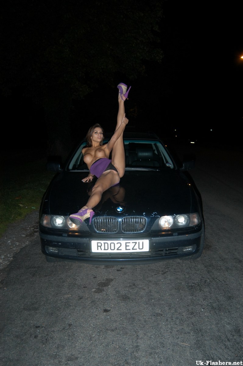 Cute amateur flashing outdoors at night on a car #67458506