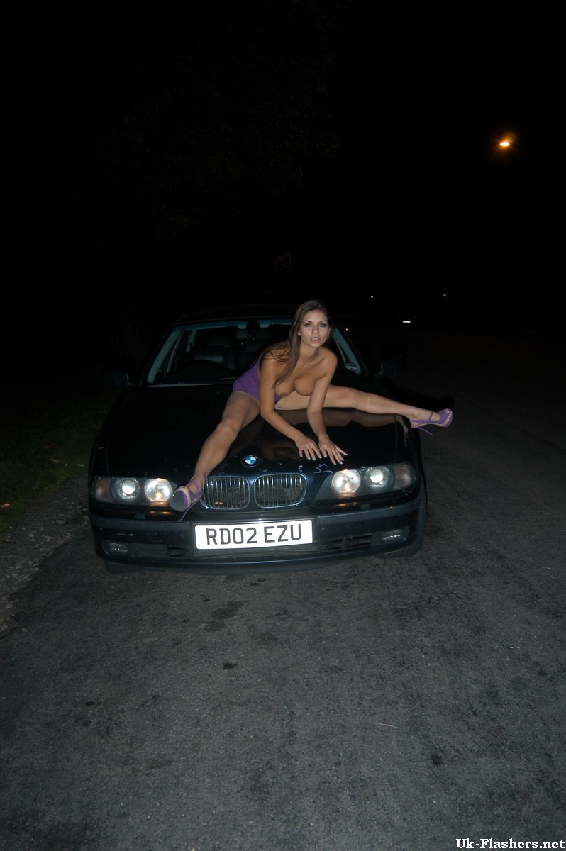 Cute amateur flashing outdoors at night on a car #67458523