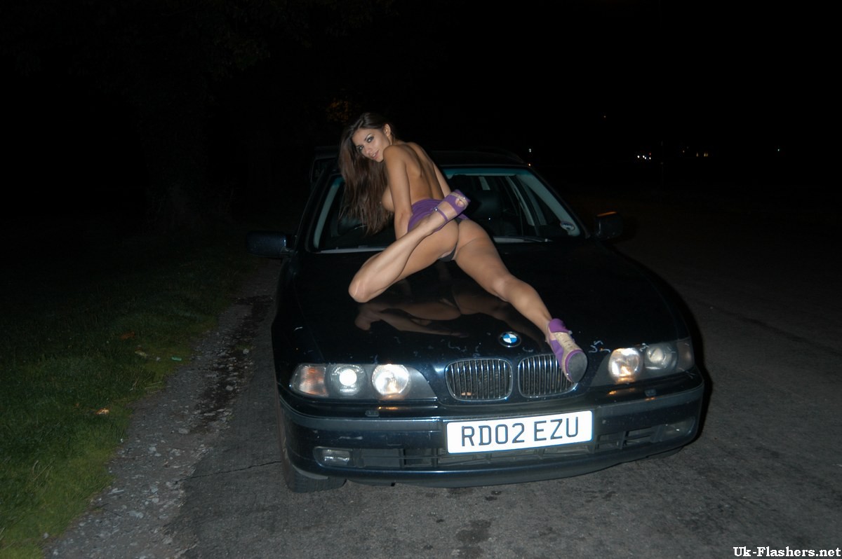Cute amateur flashing outdoors at night on a car #67458534