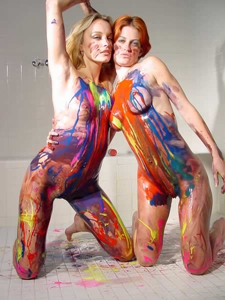 Lesbians playing with paint on each other body #74095019