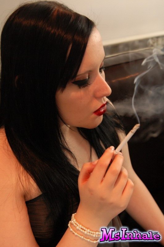 brunette teen smoking on the couch #74982067