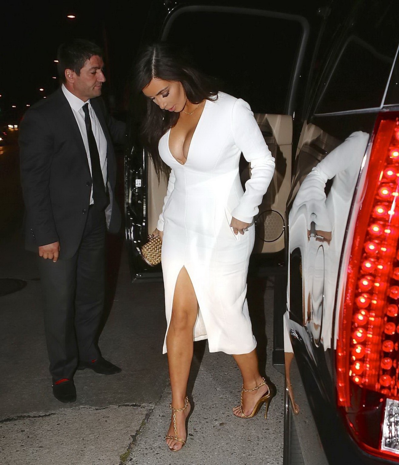Kim Kardashian cleavy and leggy in revealing white dress #75199863