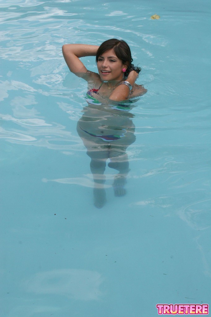 Bikini teen girl swimming in pool #73170067