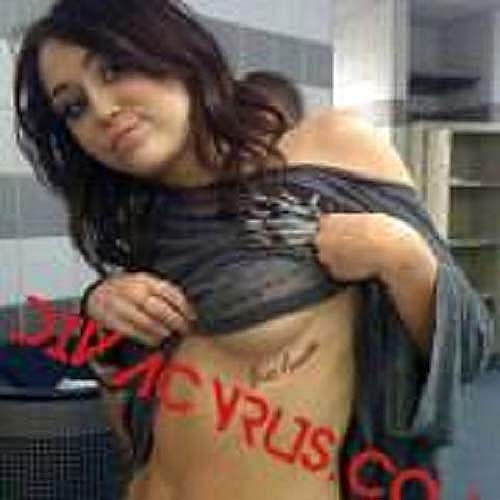 Miley Cyrus showing off tattoo and boobs on leaked photos #75265770