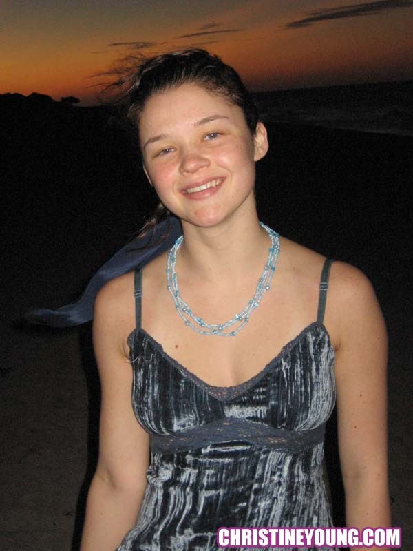 Cheerful teen Christine Young poses after dark on the beach #73118544