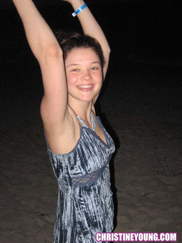 Cheerful teen Christine Young poses after dark on the beach #73118566