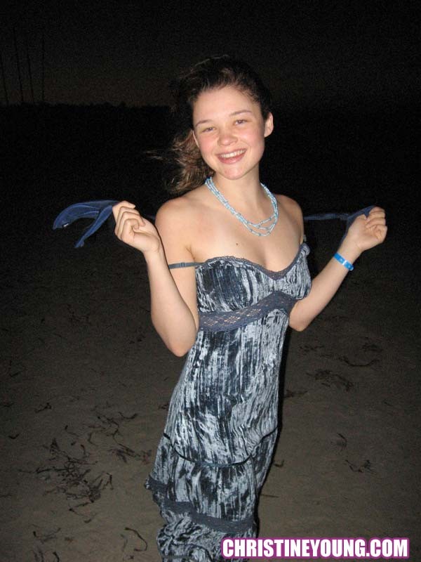 Cheerful teen Christine Young poses after dark on the beach #73118585