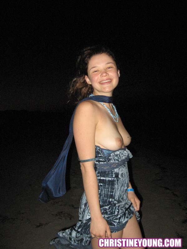 Cheerful teen Christine Young poses after dark on the beach #73118606