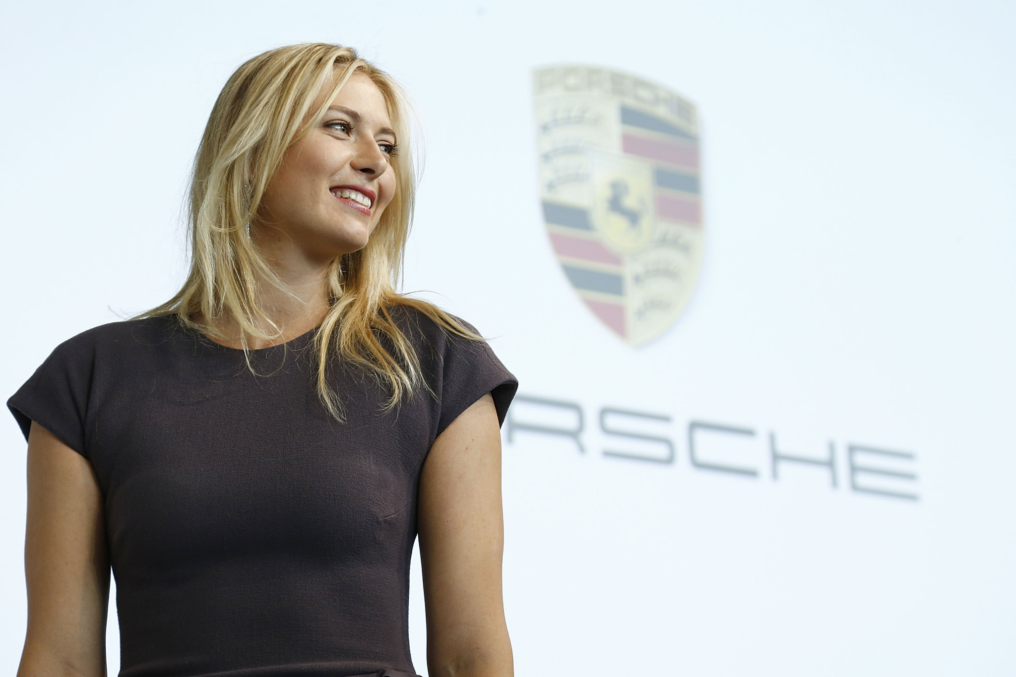 Maria Sharapova looks hot wearing a tight gray dress at the Porche event in Stut #75234364