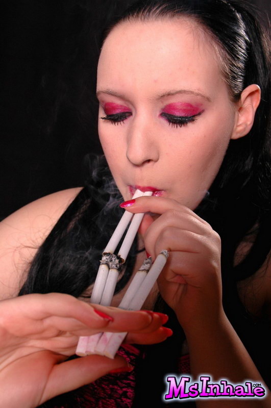 teen smoking many cigarettes at the same time #74980352