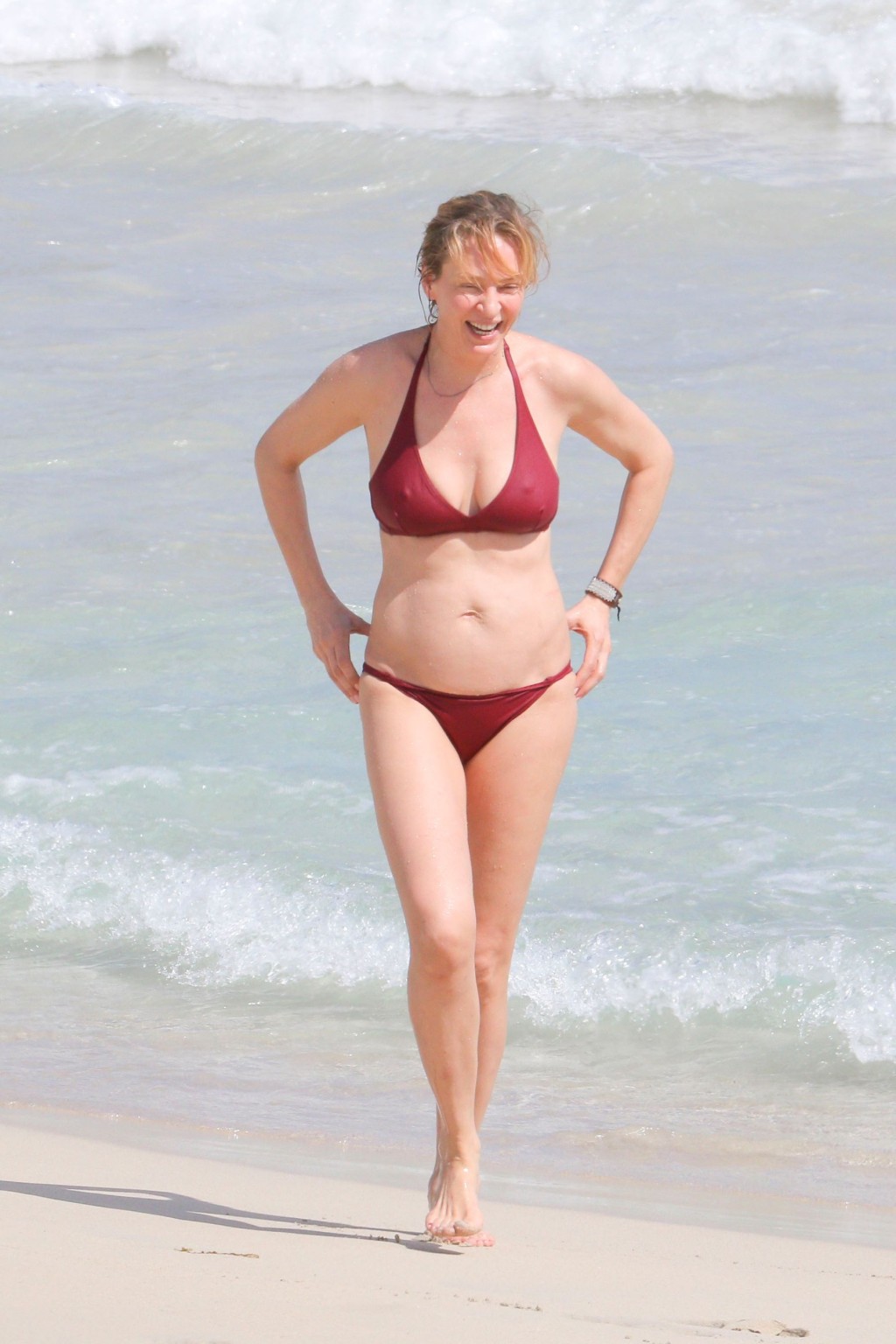Uma Thurman busty showing pokies in a skimpy red bikini at the beach in StBarts #75170088