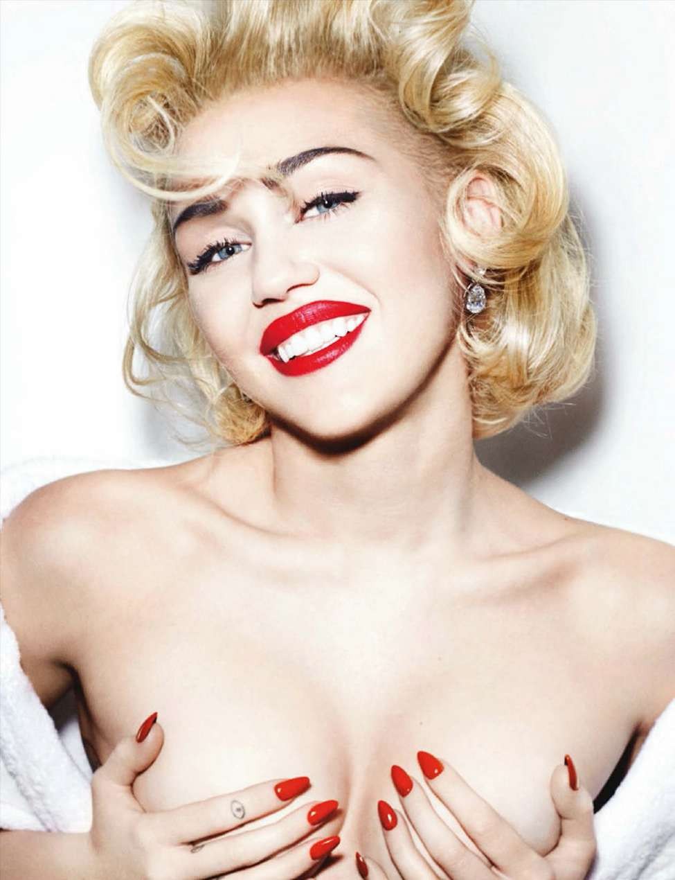 Miley Cyrus exposes her nude topless breasts for mag  #70890473