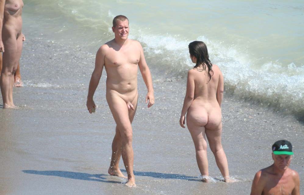 This teen nudist strips bare at a public beach #72251220