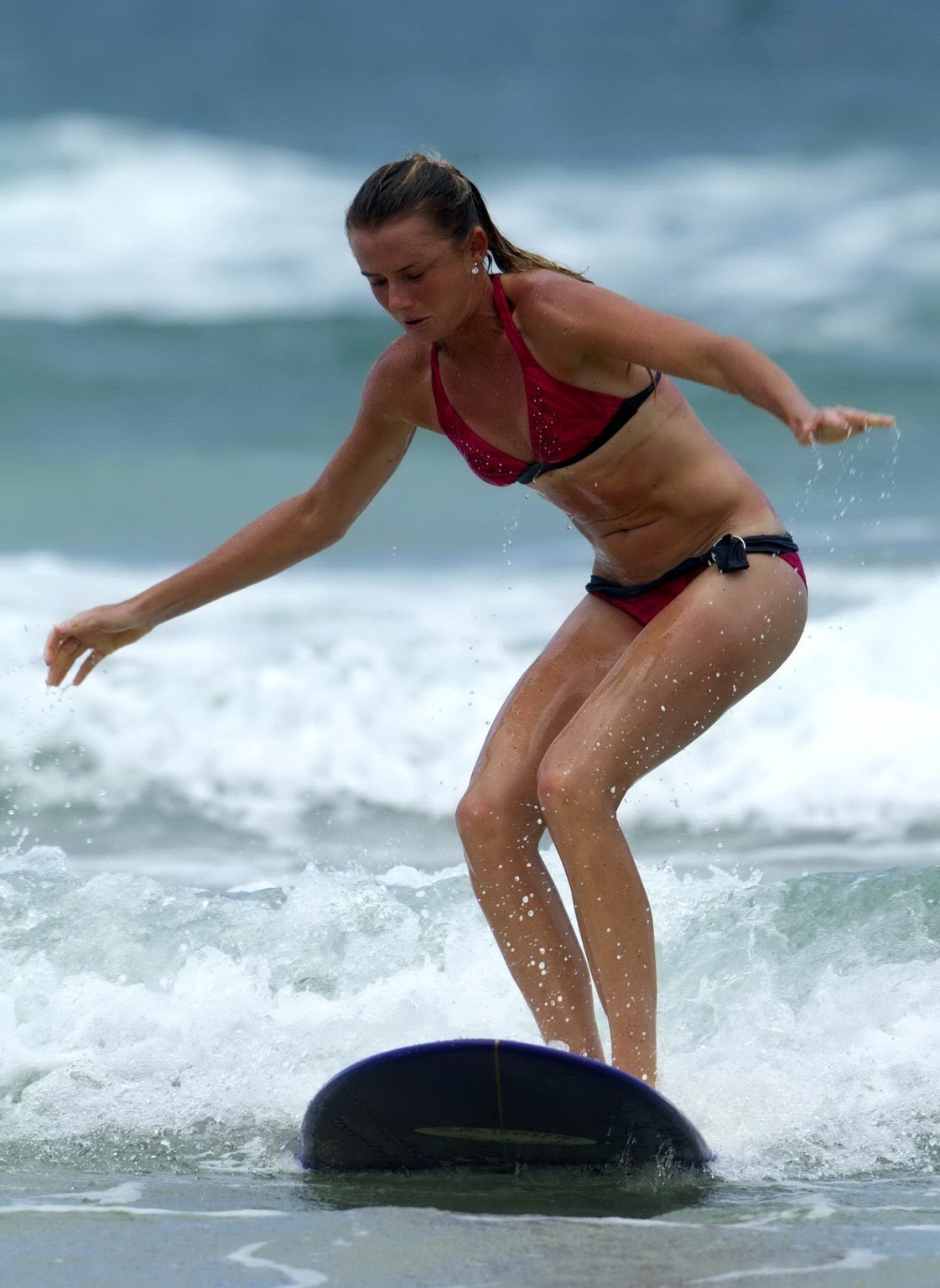 Daniela Hantuchova in bikini surfing on a beach in Brisbane, Australia #75245112