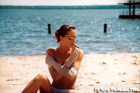 teen smoking at the beach #72322991