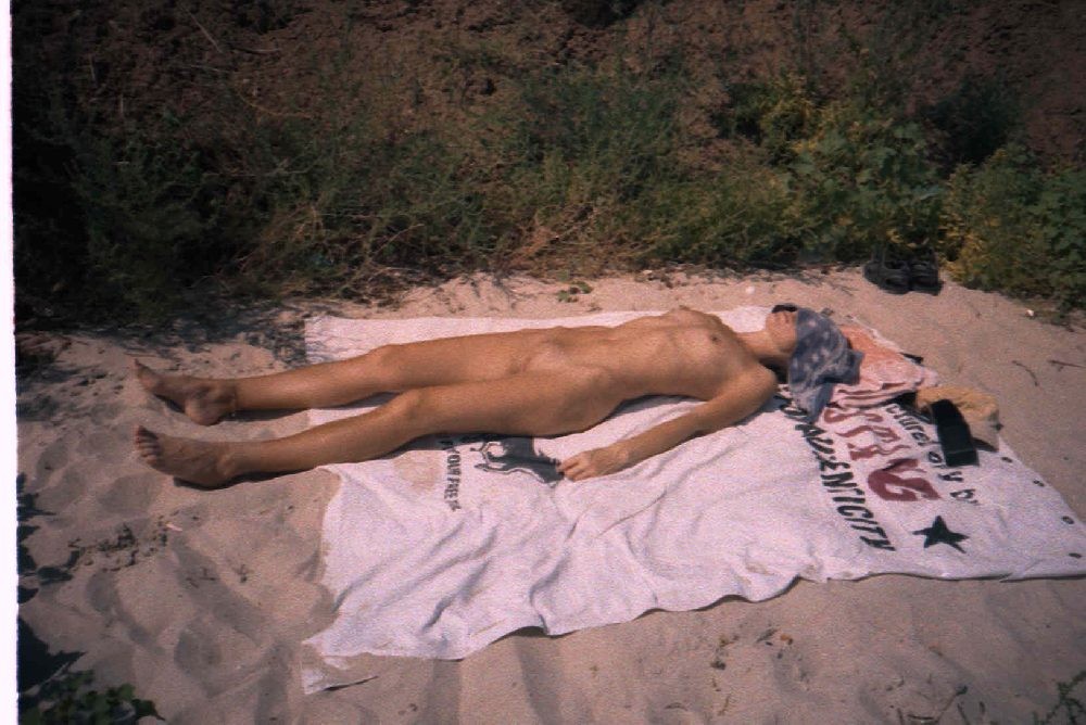 Lying out in the hot sun is this nudist's favorite #72253257