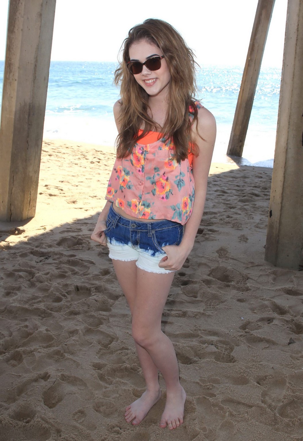 McKaley Miller wearing skimpy top and denim shorts at the beach in Los Angeles #75194299