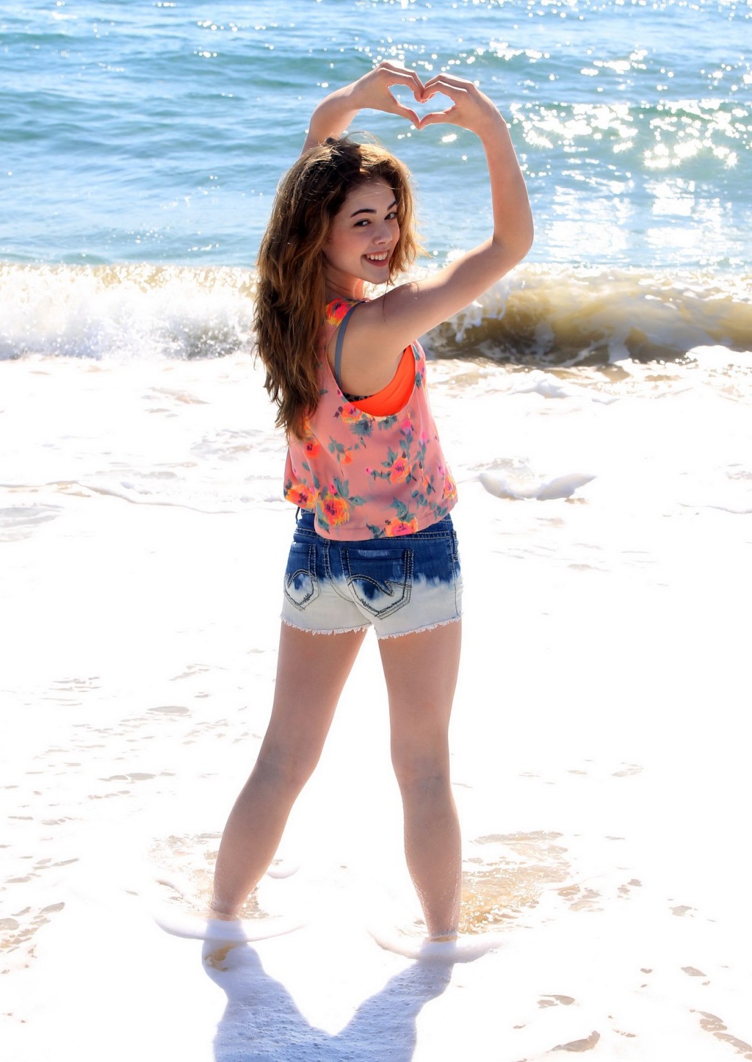 McKaley Miller wearing skimpy top and denim shorts at the beach in Los Angeles #75194340
