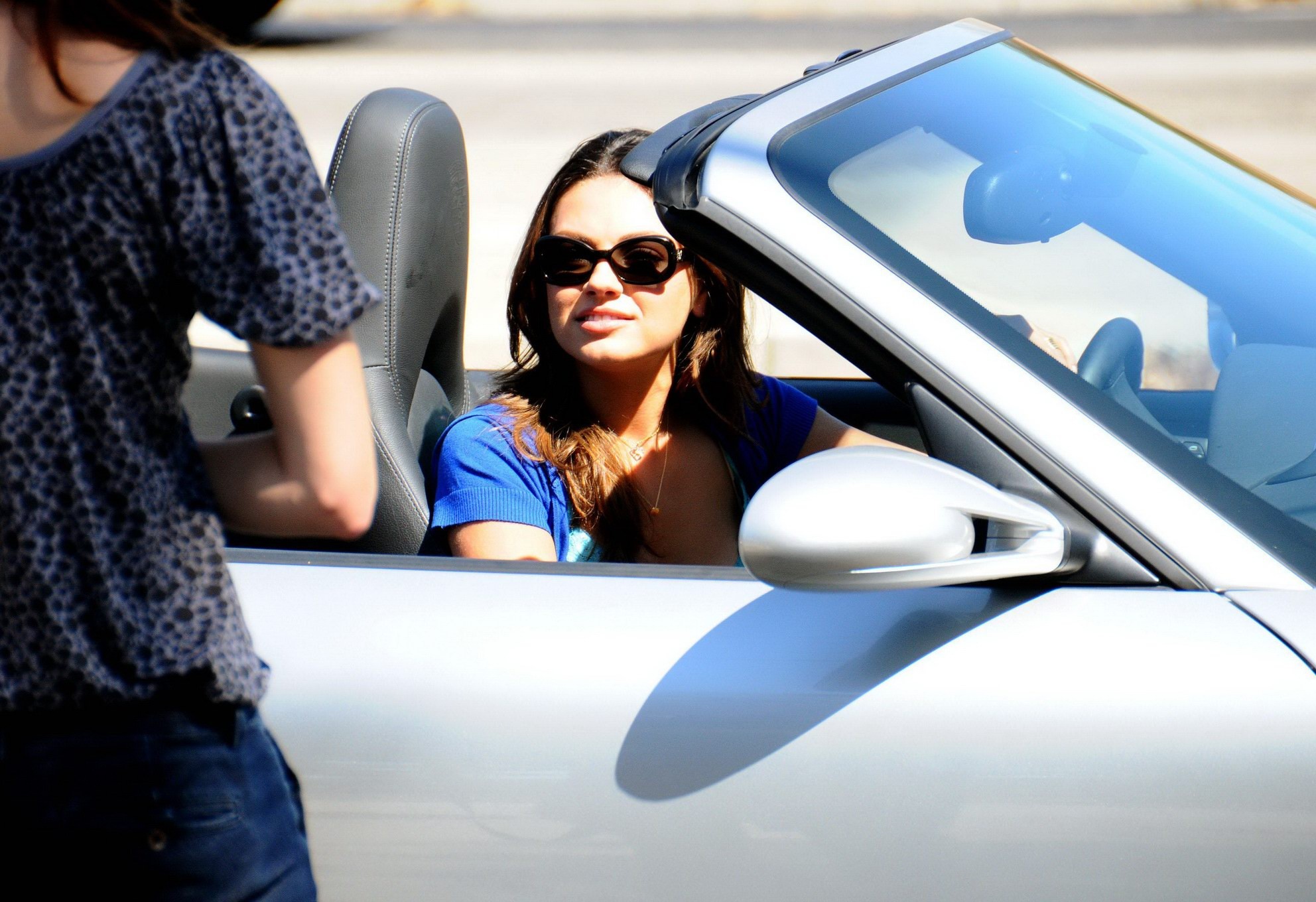 Mila Kunis leggy  downblouse cleavage on the 'Extract' set #75270952