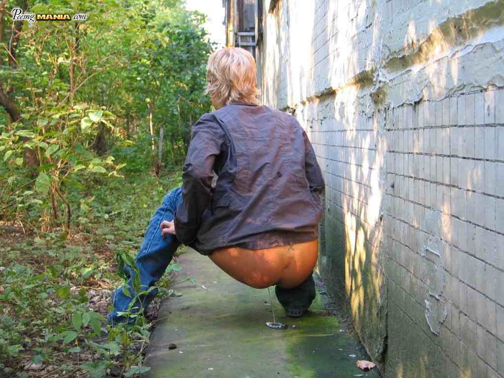 Blonde girl pissing outdoors #76587264
