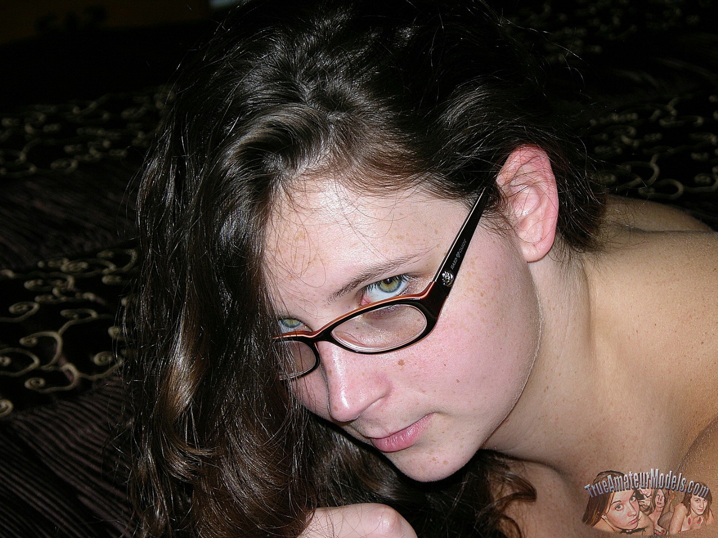 Brunette woman wearing glasses models nude #67228218