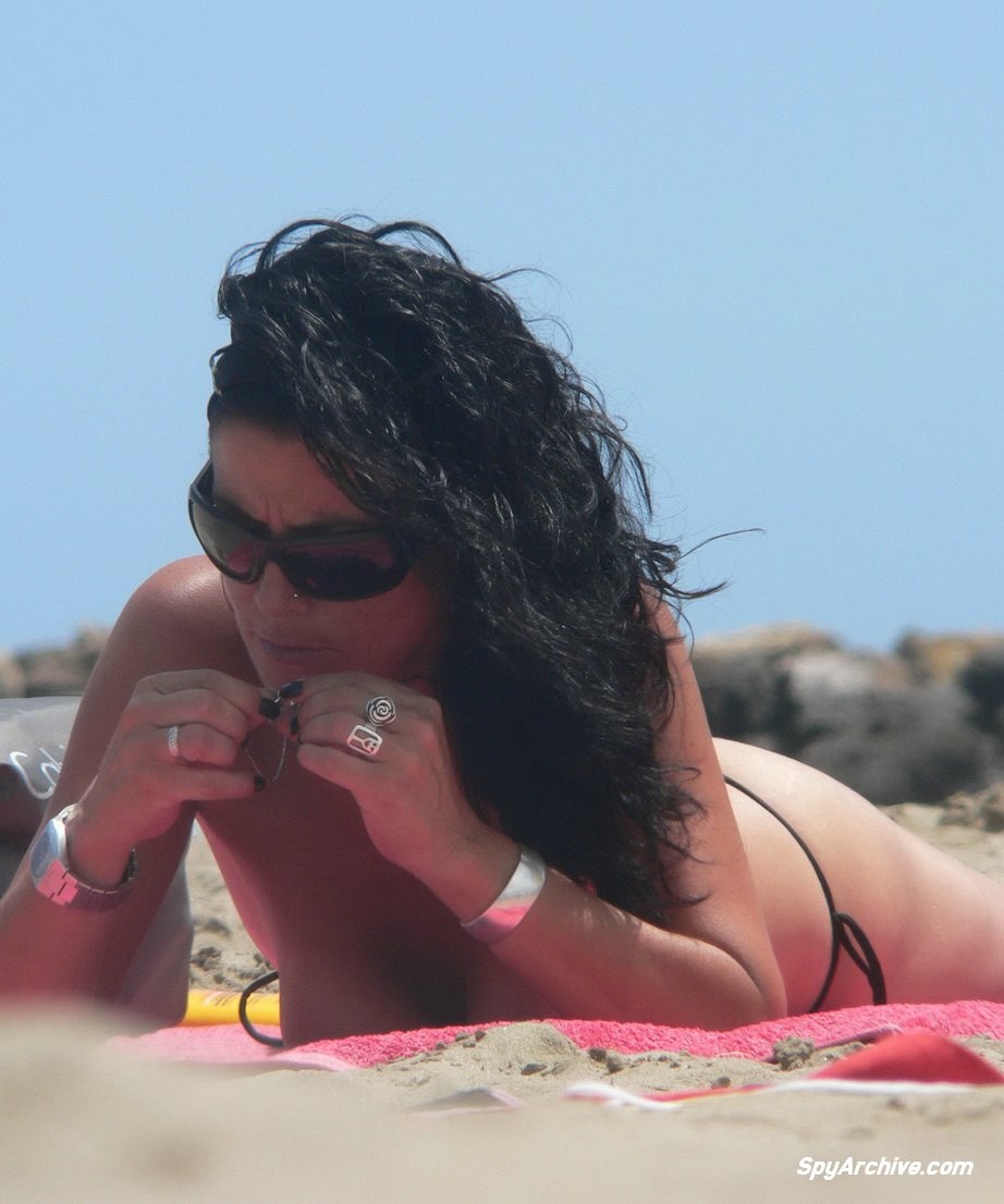 Spying on a topless milf spreading on the beach #70755297