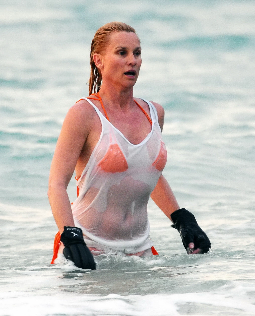 Nicollette Sheridan showing her wet bikini body while training on the beach in S #75265597