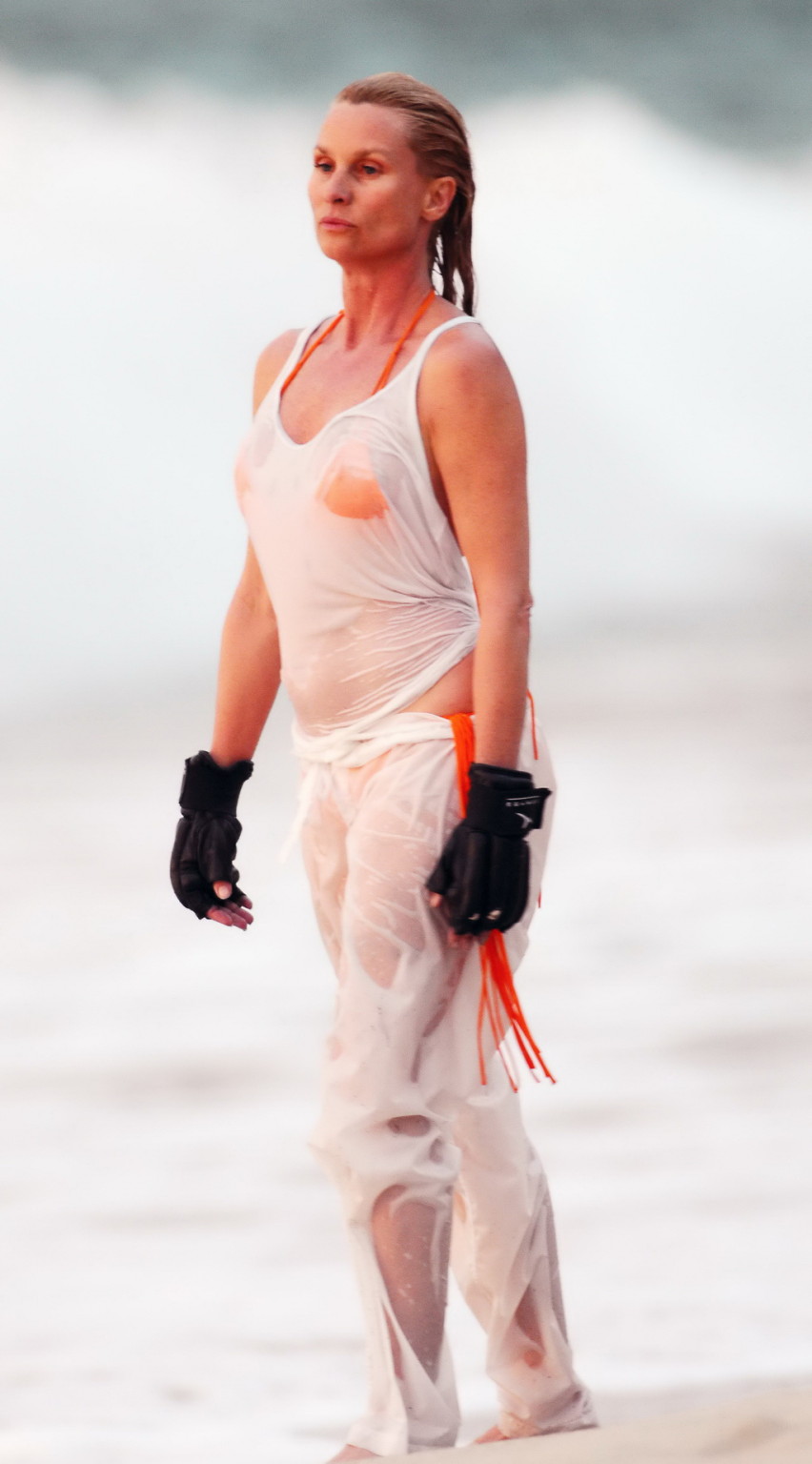 Nicollette Sheridan showing her wet bikini body while training on the beach in S #75265614