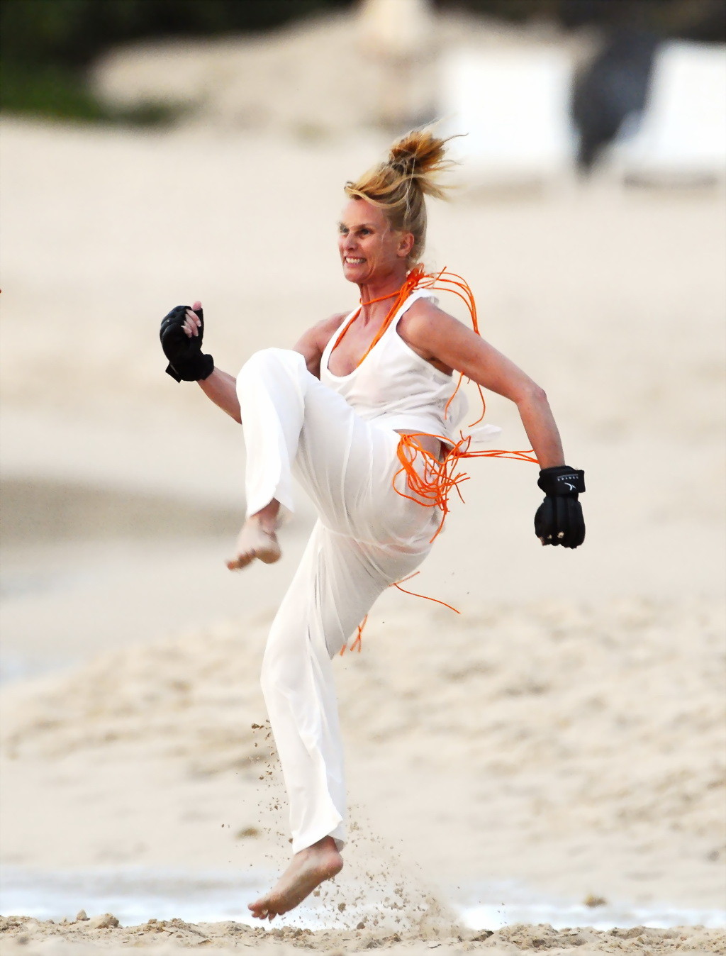 Nicollette Sheridan showing her wet bikini body while training on the beach in S #75265697