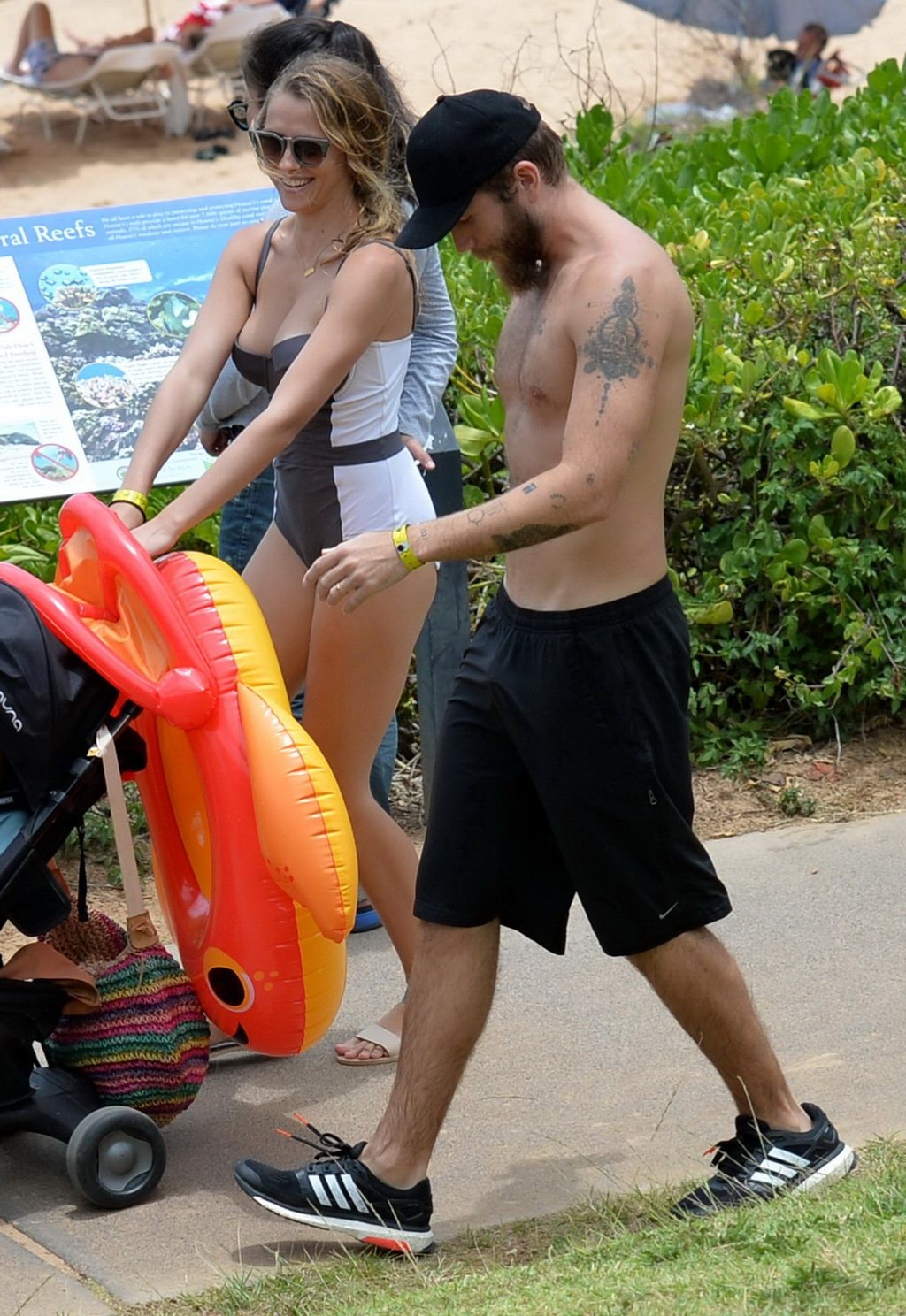 Teresa Palmer busty wearing a low cut swimsuit on a Hawaiian beach #75162386