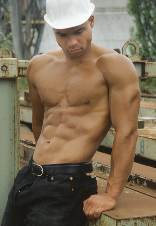 A latino muscle showing off at a deserted elevator #76911433