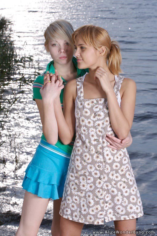 Two exciting blonde teens stripping and teasing on the sea shore #78184061