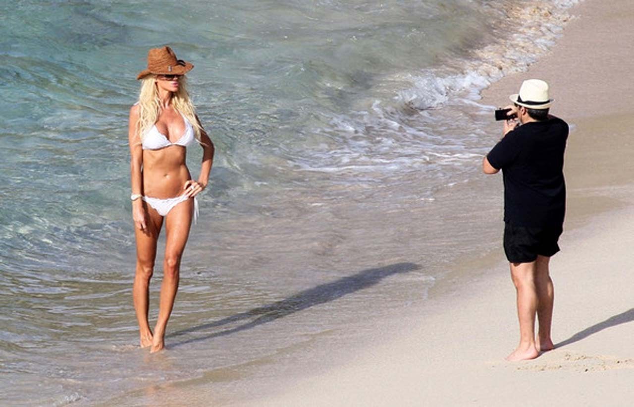 Victoria Silvstedt exposing her nice body in white bikini on beach #75321499