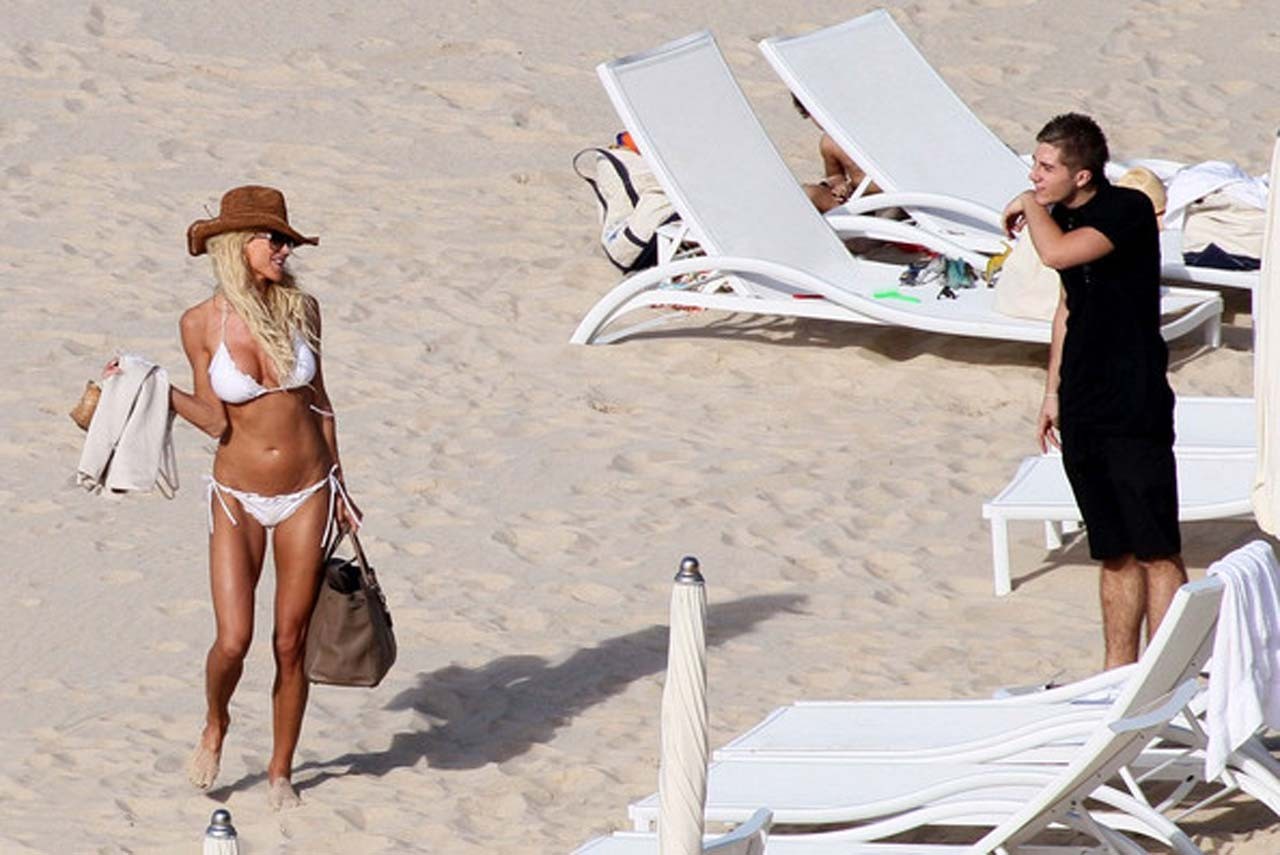 Victoria Silvstedt exposing her nice body in white bikini on beach #75321525