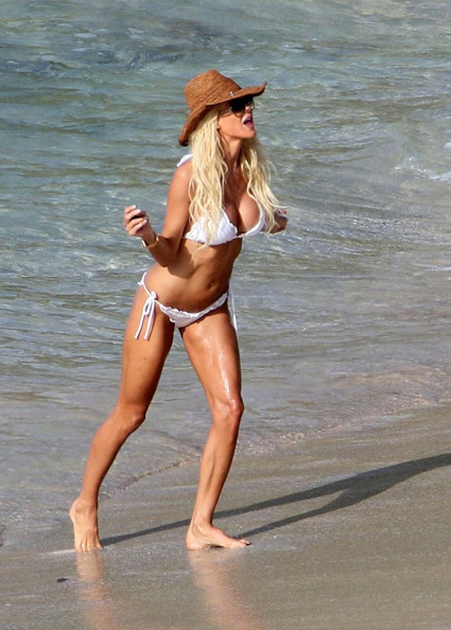 Victoria Silvstedt exposing her nice body in white bikini on beach #75321563