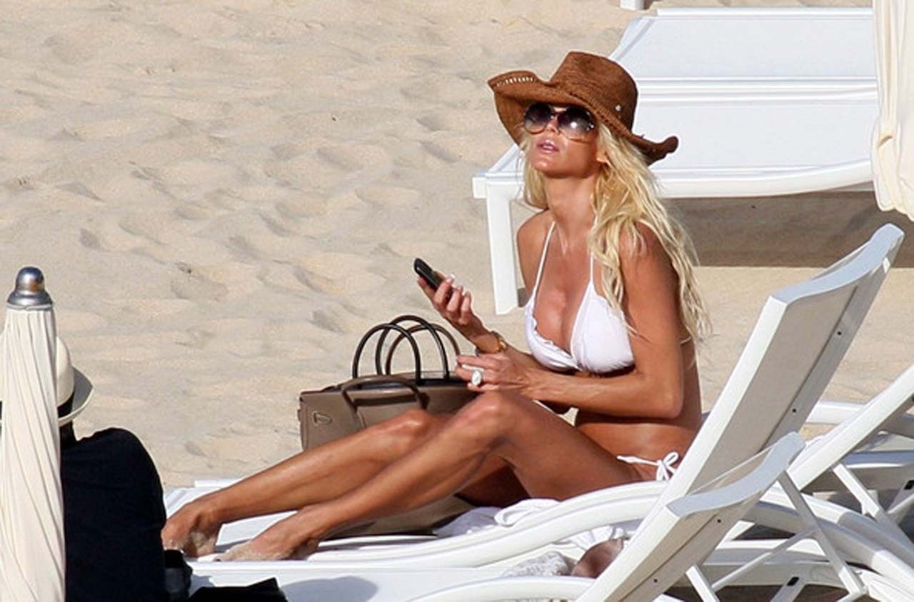 Victoria Silvstedt exposing her nice body in white bikini on beach #75321568