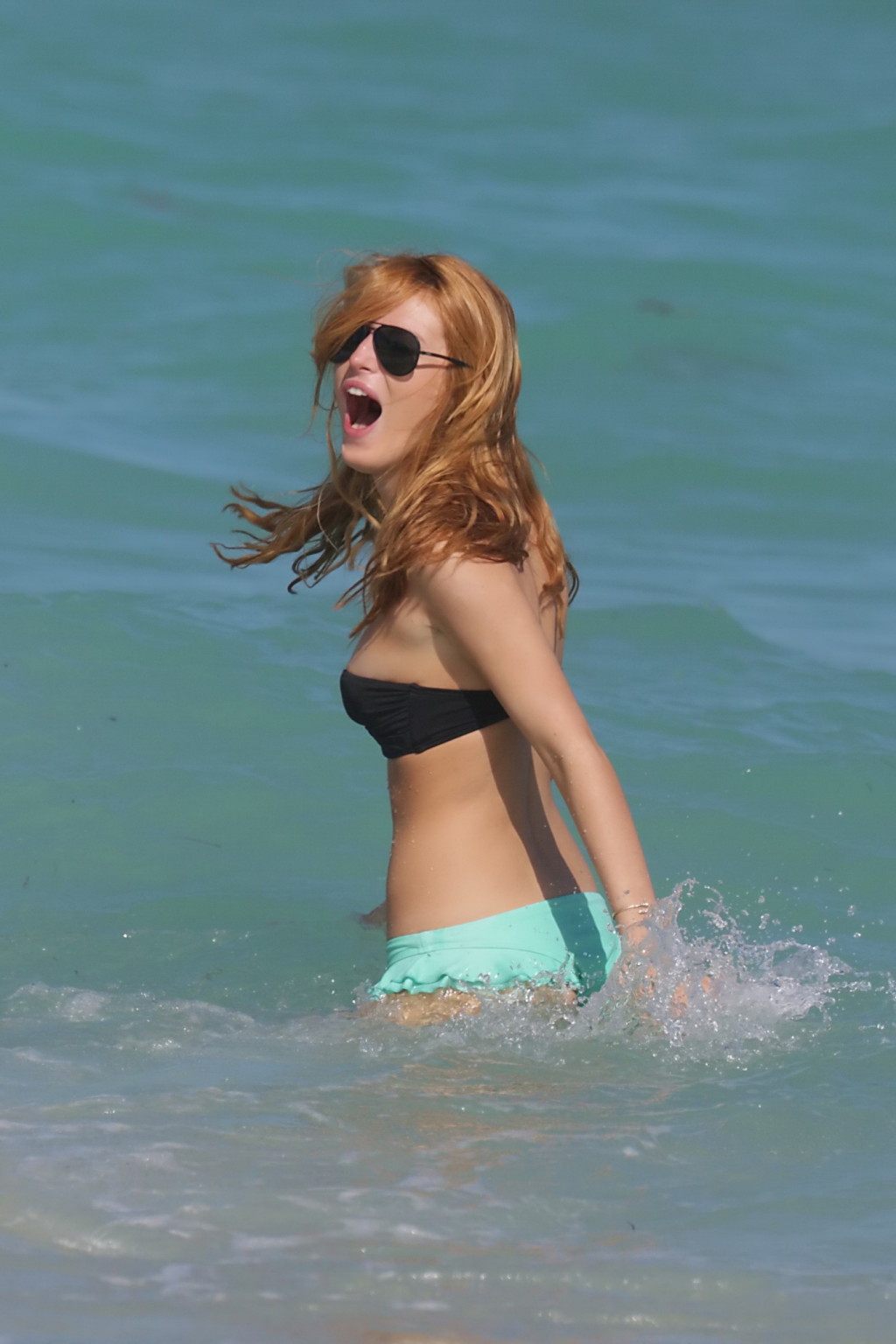 Bella Thorne nipslip and showing her juicy ass in a strapless bikini at the beac #75180608