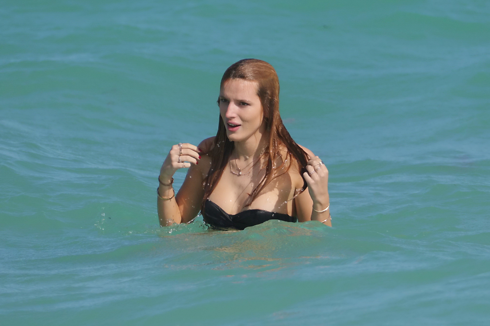 Bella Thorne nipslip and showing her juicy ass in a strapless bikini at the beac #75180629