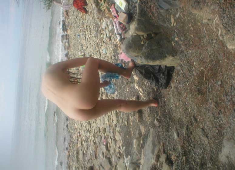 Blonde has some fun being nude on a public beach #72251927